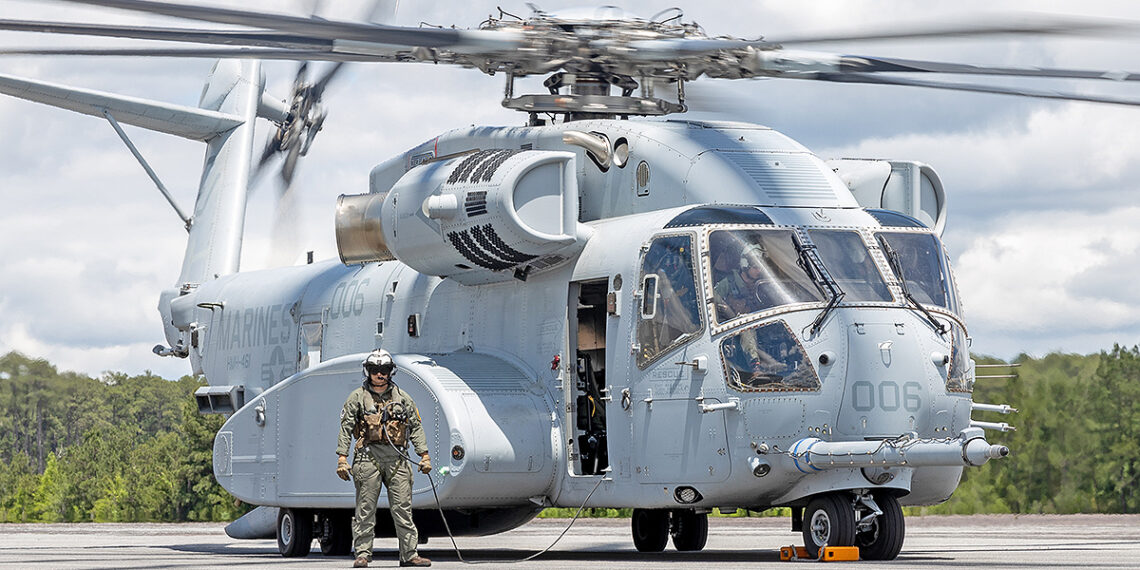 A U.S. Marine with Heavy Helicopter Squadron (HMH) 461, 2nd Marine Aircraft Wing, steps off of a Sikorsky CH-53K King Stallion at Marine Corps Air Station Cherry Point, North Carolina, May 11, 2024. The 2024 MCAS Cherry Point Air Show, which is jointly hosted by MCAS Cherry Point and 2nd Marine Aircraft Wing, drew more than 80,000 guests and participants to Eastern North Carolina. (U.S. Marine Corps photo by Lance Cpl. Isabella Ramos)